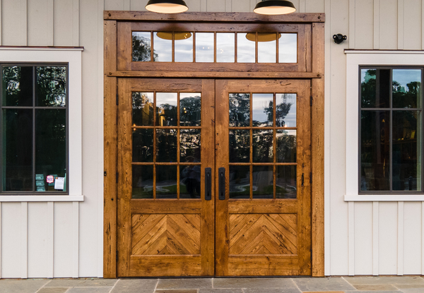 custom wooden entrance door at south county brewing Entranceway to timber frame home made from reclaimed white oak