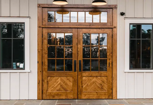 custom-wooden-entrance-door-at-south-county-brewing Entranceway to timber frame home made from reclaimed white oak