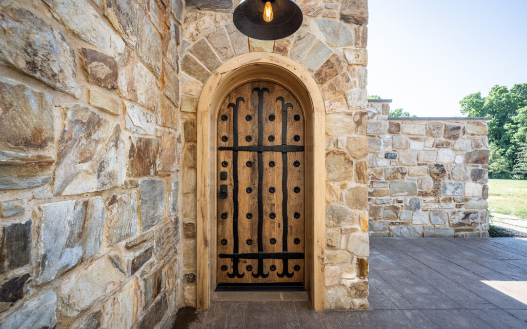 luxury custom door made from reclaimed wood and hand forged iron